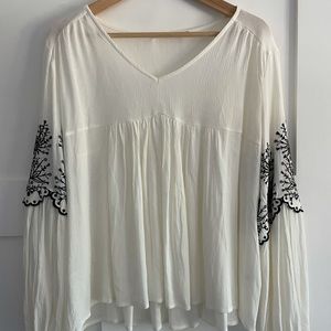 Francesca’s embroidered black flowers top